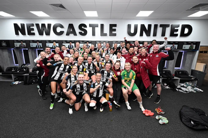 The team celebrates in the changing room following a Tyne-Wear derby win.