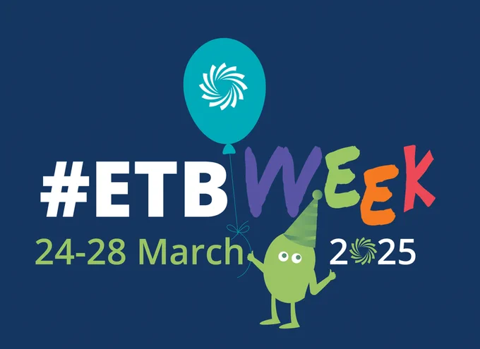 Logo of a character holding a balloon with a hashtag and event dates. 
