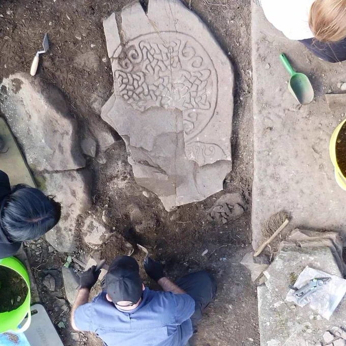 Aerial view of carved stone being excavated