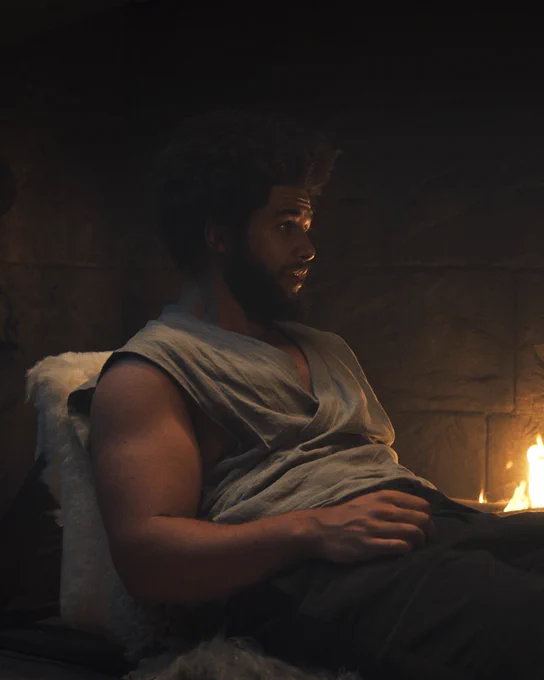 Perrin Aybara (Marcus Rutherford) sits by the fireplace in The Winespring Inn.