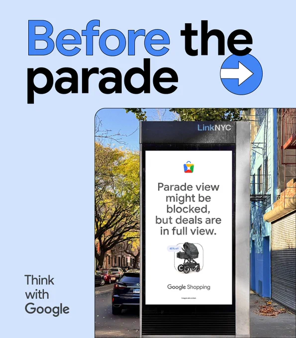  Before the parade. An out-of-home ad for a baby stroller says: Parade view might be blocked, but deals are in full view.