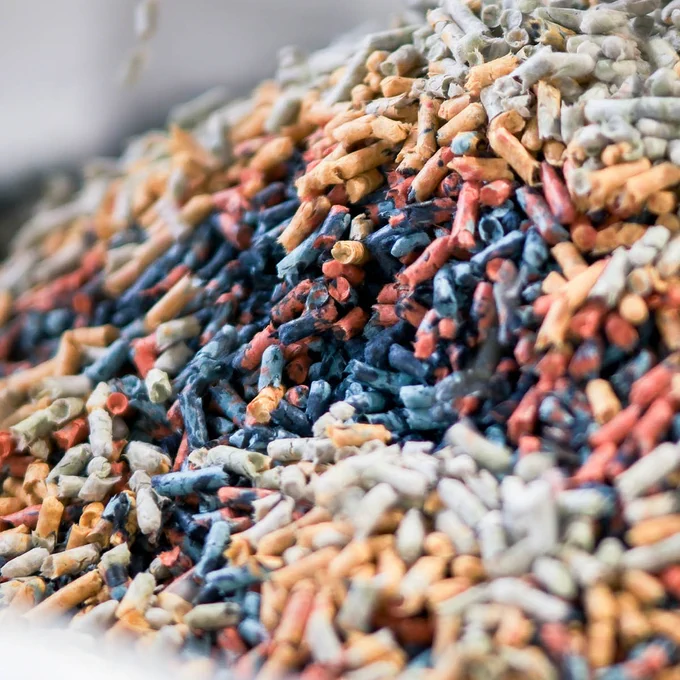 Close-up of a colorful pile of organic rice grains in various shades.