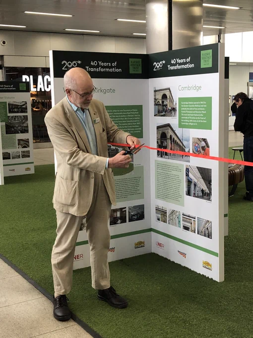 Andy Savage cuts the ribbon to open the exhibition