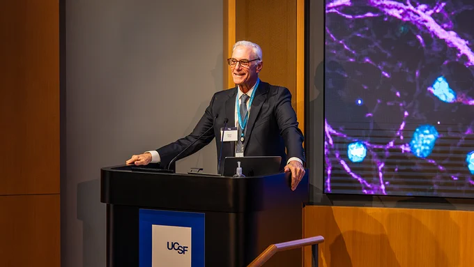 UCSF Brain Tumor Center director Mitchel Berger, MD, delivering his remarks at the podium.