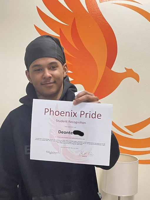 student with certificate