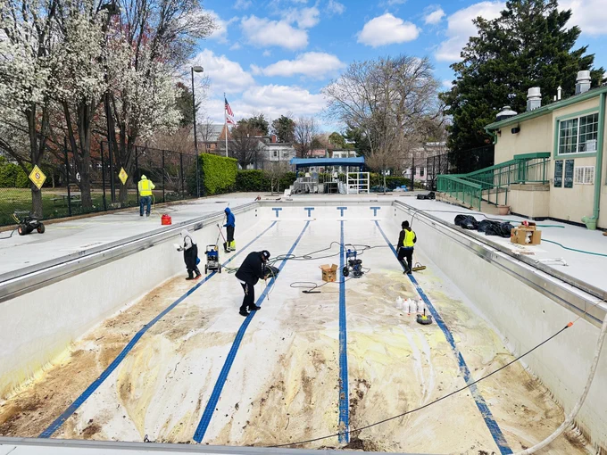 DGS Facilities Team cleans and prepares outdoor pools for the summer.
