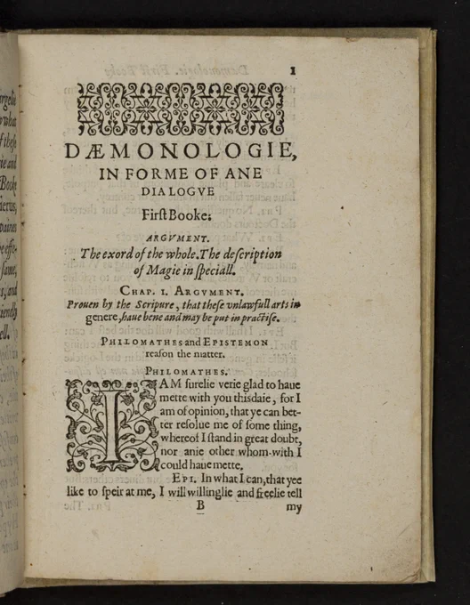 Open page of the book "Daemonologie" by King James I, showing ornate black text on aged paper with decorative borders and titles.