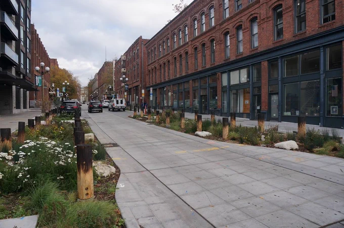 Improvements made to South Main Street at Occidental Park in Pioneer Square include native plants and wood pilings that tie into the neighborhood's history.
