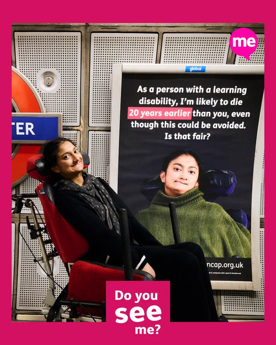 Mencap campaigners posing next to posters in the Westminster tube station.  The text says "People with a learning disability die, on average, up to 20 years younger than the general population, even though this could be avoided with the right healthcare."