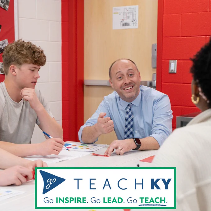 Teacher, C.J. Fryer engages in a lesson with a group of students.  Go Inspire.  Go Lead.  Go Teach.