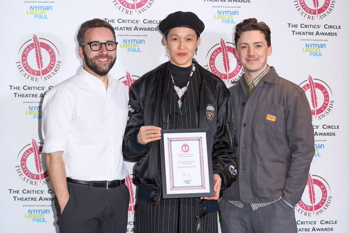 Choreographer Julia Cheng, Artistic Director Drew McOnie and Executive Director James Pidgeon pose with an award certificate.