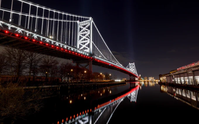 Images of Philadelphia landmarks are photographed lit up red for the Phillies home opener