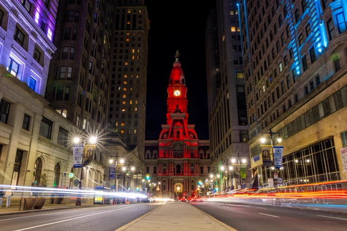Images of Philadelphia landmarks are photographed lit up red for the Phillies home opener