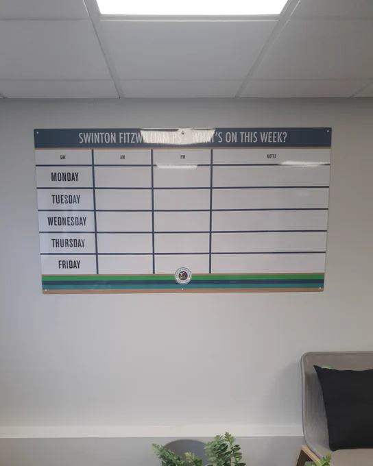 Custom drywipe board featuring a Monday-Friday grid in school branded colours.