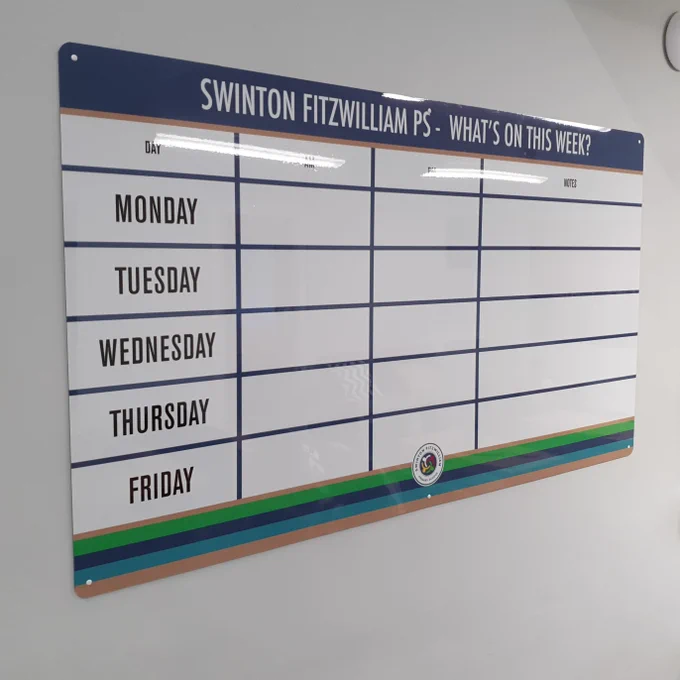 Custom drywipe board featuring a Monday-Friday grid in school branded colours.
