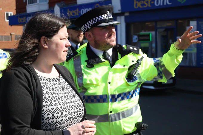 PCC Emily Spurrell speaking with a police officer in Garston