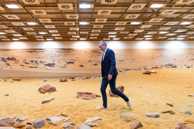 Technology Secretary Peter Kyle, walks across the Mars Yard simulation environment. 