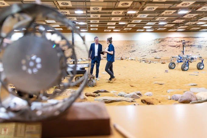 Technology Secretary Peter Kyle (left) speaks to Senior GNC and Robotics Engineer Yvonne Pickering (right) on the Mars Yard simulation environment. 