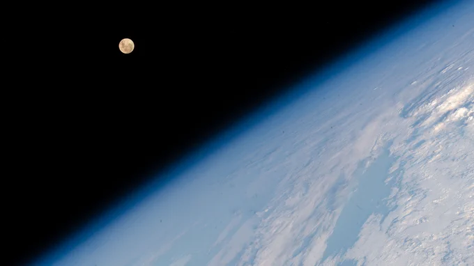 The Full Moon pictured above Earth’s horizon as the International Space Station soared 262 miles above the Indian Ocean south of the African island nation of Madagascar.