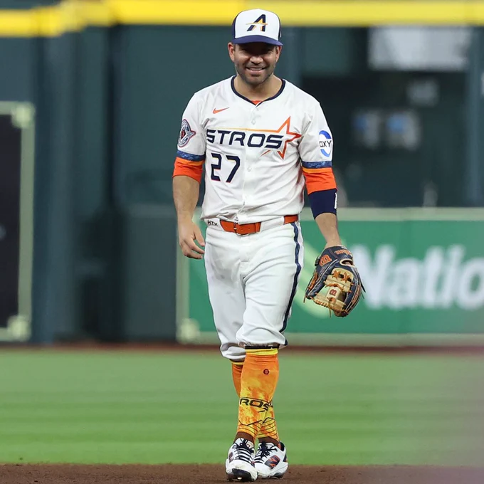 Jose Altuve stands at second base in a new Astros City Connect uniform. He wears custom City Connect themed socks to match the uniform.