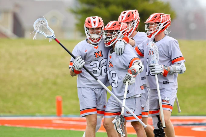 Jack Wasik (#32) and Caleb Bennett (#19) celebrating a goal in the first half of the game (Sports Information Photo/Evelyn Megery)
