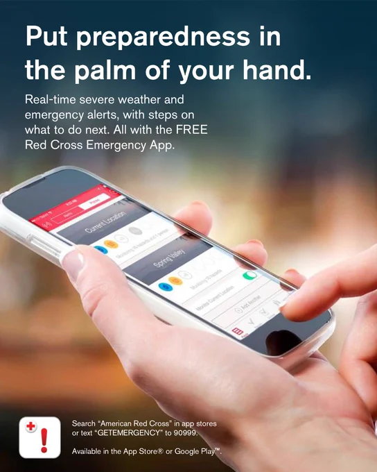 Close-up of a hand holding a smartphone displaying the Red Cross Emergency App, which provides real-time severe weather alerts and other emergency notifications.