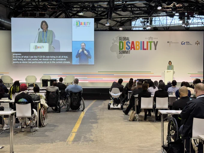 Diana speaking at the podium during the closing 