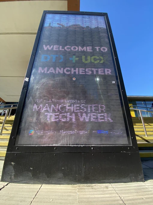 Sign with text reading Welcome to DTX   UCX Manchester