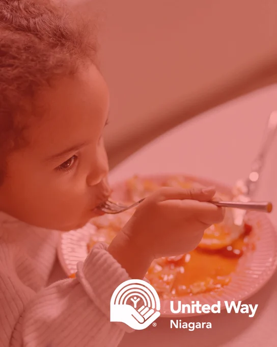 Young girl eating food - United Way Niagara