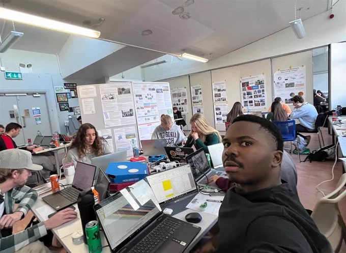 Photo of students working on the project. 