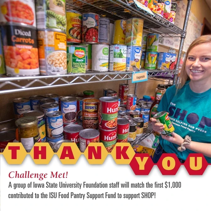 An Iowa State University staff member stocking shelves at the ISU Food Pantry, surrounded by various canned and packaged foods, celebrating a successful fundraising challenge.