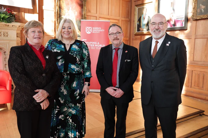 Image shows Invest NI's Vicky Bell; Queen's Lorraine Marks and Professor Archie Clements; and Innovate UK's Richard Lamb. They are pictured in front of the stage in the Great Hall.
