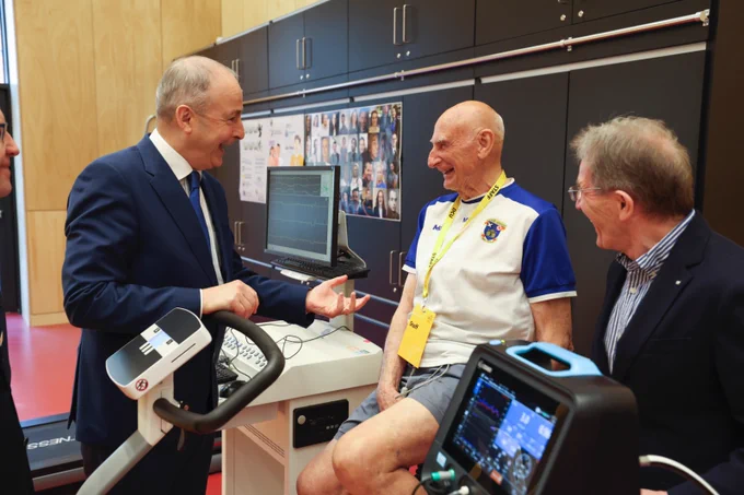 An Taoiseach Micheál Martin TD shares a joke with former Dublin selector Mickey Whelan and Prof Niall Moyna from Dublin City University's School of Health and Human Performance Photo: Kyran O'Brien