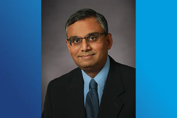 Headshot of Anand Sivasubramaniam placed on a blue background