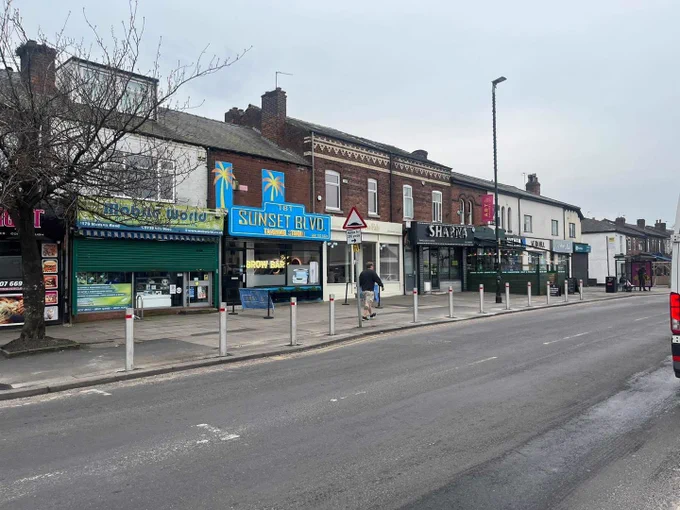 A row of bollards along Monton Rd