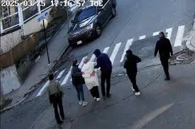 In this image taken from security camera video, Rumeysa Ozturk, a 30-year-old doctoral student at Tufts University, is detained by Department of Homeland Security agents on a street in Sommerville, Mass., Tuesday, March 25, 2025. -- Associated Press