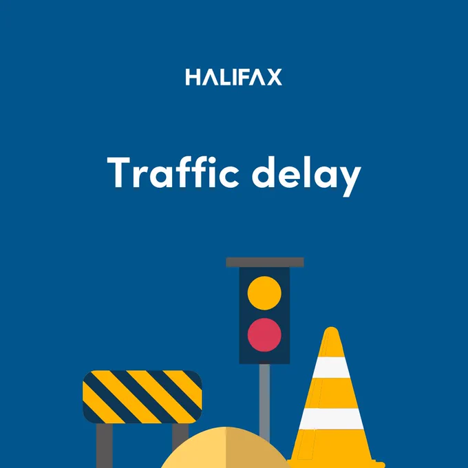 Blue background with an illustration of road construction signage and the words 'Traffic delay'. 