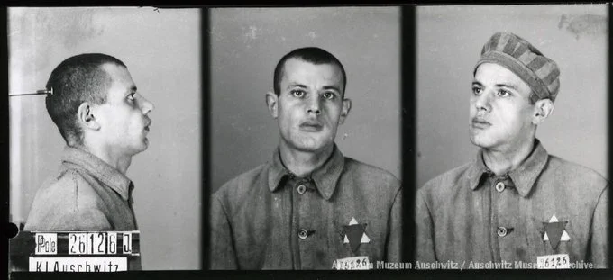 A mugshot registration photograph from Auschwitz. A man with a shaved head wearing a striped uniform photographed in three positions (profile and front with bare head and a photo with a slightly turned head with a hat on). The prisoner number is visible on a marking board on the left.
