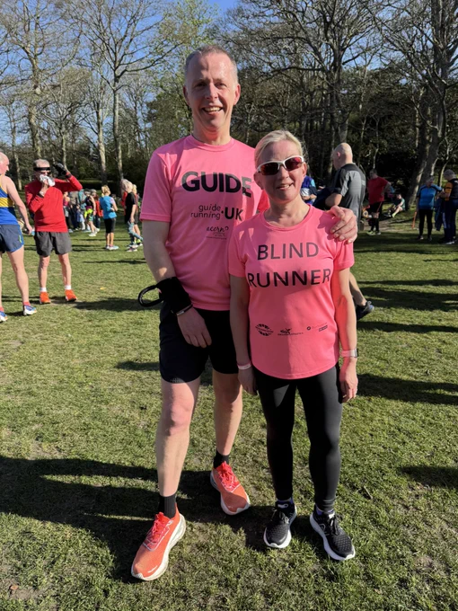 Kelly and Mike after parkrun both wearing bright pink tops