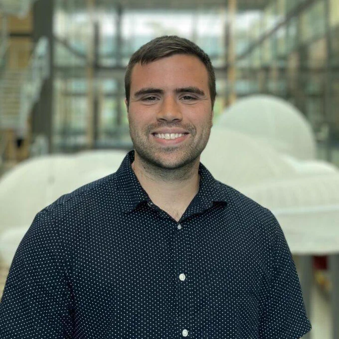 Head-and-shoulders image of Brandon standing in Frick Lab at Princeton Chemistry. 
