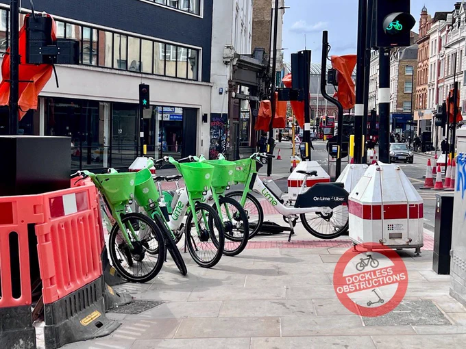 Lime bikes obstructing pavement at busy King’s Cross pedestrian crossings in Islington. 18th April 2025.