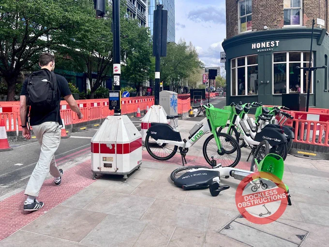 Lime bikes obstructing pavement at busy King’s Cross pedestrian crossings in Islington. 18th April 2025.