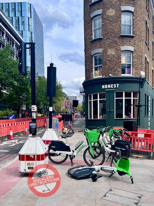 Lime bikes obstructing pavement at busy King’s Cross pedestrian crossings in Islington. 18th April 2025.