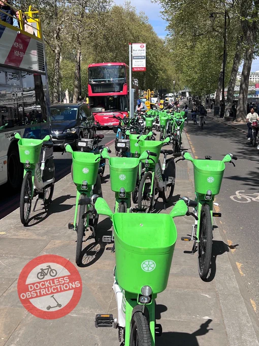 Island bus stop between road carriageway and cycleway totally obstructed with dockless hire ebikes.