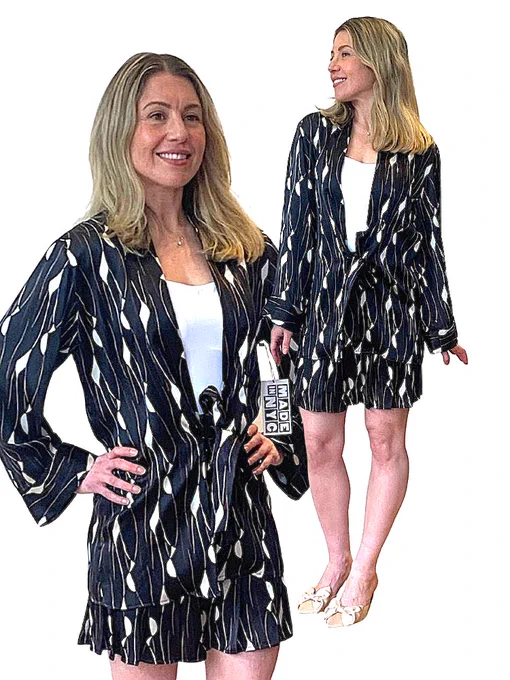 Le Smoking Hot Jacket
$398.00
This 100% silk charmeuse over jacket is a stunner. Pair it with a turtleneck and our Wide Leg Pants to elevate a casual look. Wear it with the Shirred Skirt for an evening outfit.

Machine was gentle and dry flat.

This piece is made of locally sourced materials and is sewn in New York City.

This piece is made to order. Please allow 2-3 weeks or delivery.

Pleated Mini Skirt
$325.00
This skirt is a statement piece for your wardrobe. The conversational print will also spark interest. Pair it with a thick pair of tights, or over our Pencil Pant in Ponte for a warm and fashionable look.

The skirt measures 17” long from waist to hem.  It has a center back zipper entry and button closure.

This skirt is Made in NYC of rescued fabrics. This is a silk and viscose blend.