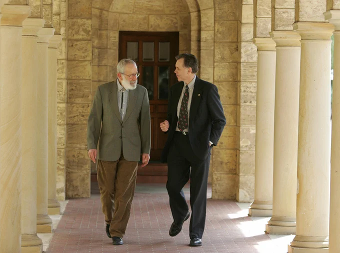 Robin Warren and Barry Marshall walk to a press conference at the University of Australia, 4 October 2005, after being awarded the Nobel Prize. 