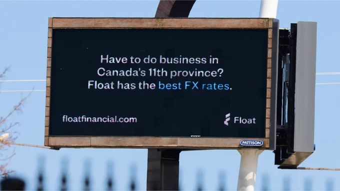 Digital billboard advertisement for Float, promoting their foreign exchange rates for business in Canada's 11th province, with the website displayed as floatfinancial.com.