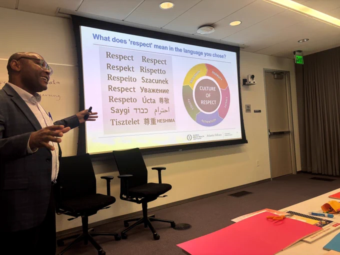 Atlantic Fellow Damas Andrea Mlaki presents at the Respect Salon.