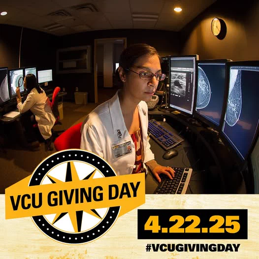 Two women in white lab coats looking at medical images on computer screens in a dark room with V C U giving day logo with date April 22 20 25