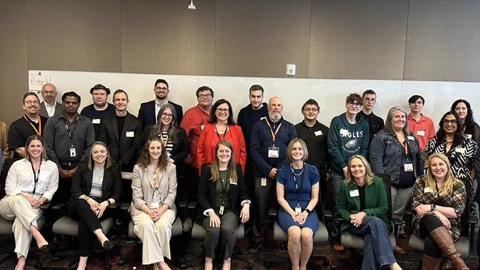 Group photo of L&I's OVR and Deloitte employees during mentoring day for high school students with disabilities.
